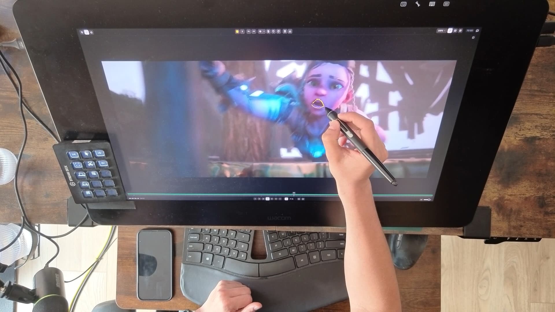 An animator drawing a note directly on a frame in Juggle, on a pen display
